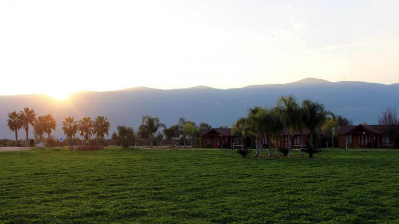 Solnedgang over The Village Jordan Riverside